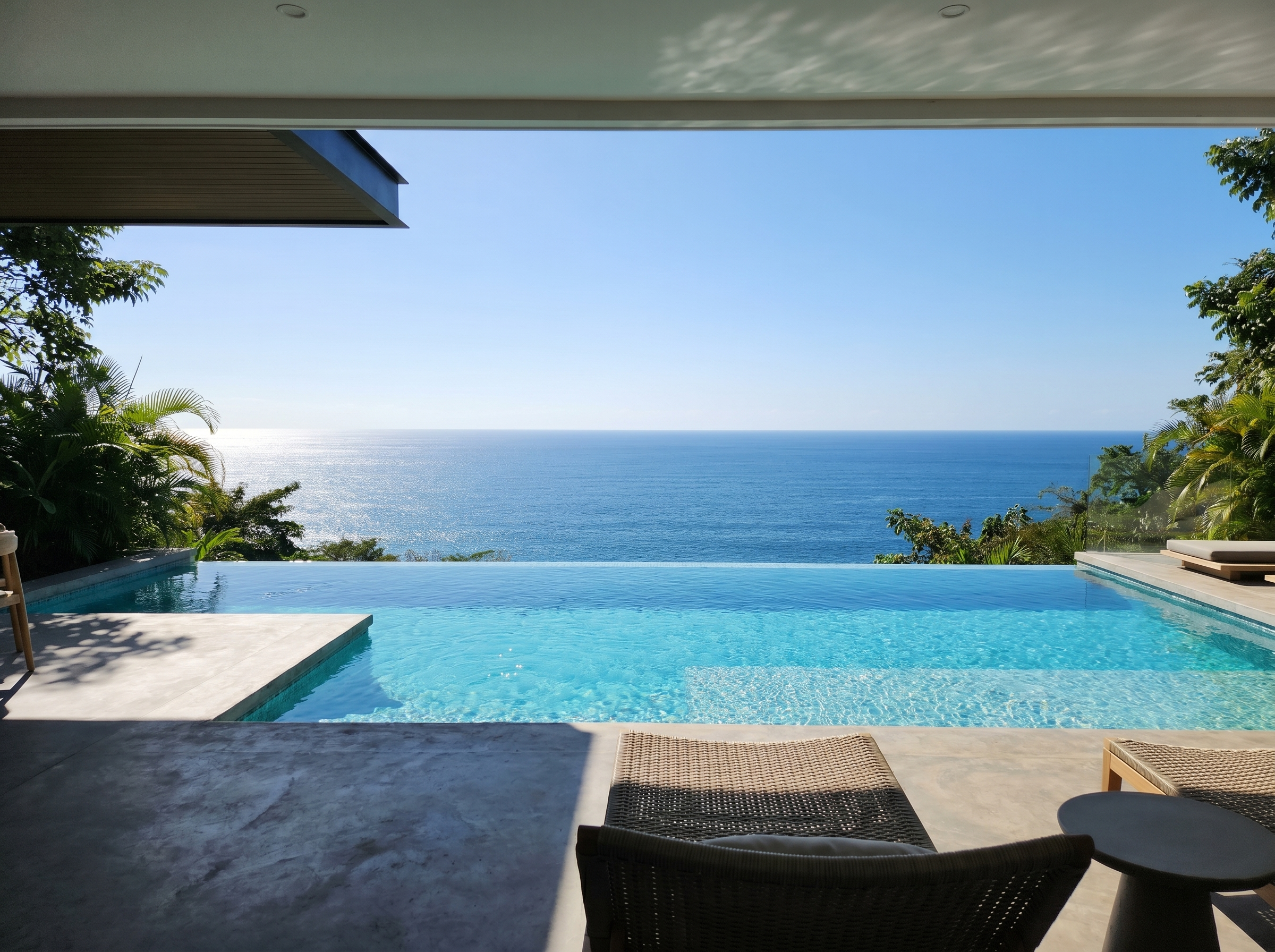 Private infinity-edge pool overlooking the Pacific Ocean in golden light